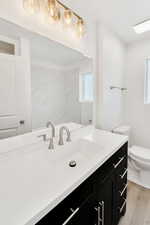 Bathroom featuring vanity and light wood-style floors