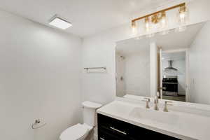 Full bathroom with vanity and tiled shower