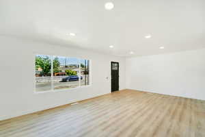 Spare room with recessed lighting and light wood-type flooring