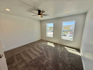 Spare room featuring carpet floors, recessed lighting, and a ceiling fan