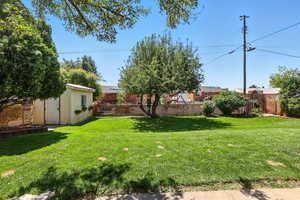 View of yard featuring a storage shed