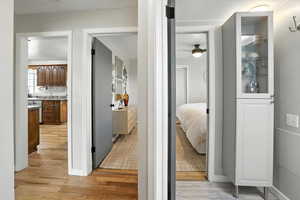 Hallway with light wood finished floors and baseboards
