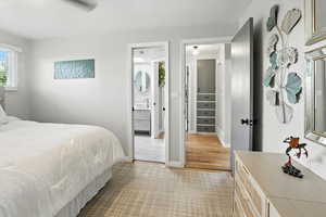 Bedroom featuring light colored carpet and light wood finished floors
