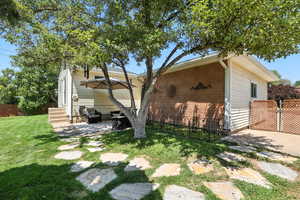 View of property exterior with a patio