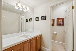 Bathroom featuring vanity and a textured ceiling