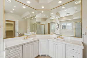 Bathroom with a shower stall, double vanity, recessed lighting, a bath, and tile patterned floors