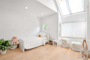 Bedroom featuring wood finished floors and recessed lighting