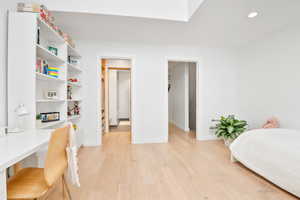Bedroom with light wood-type flooring and recessed lighting