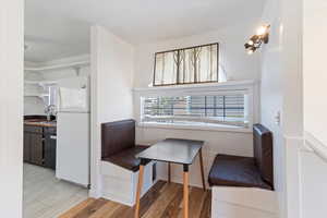 Adorable dining booth just outside the kitchen