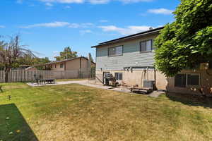 Rear view of property featuring the patio