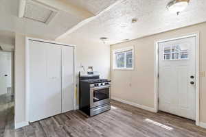 Small basement living area/kitchen area and the back entrance