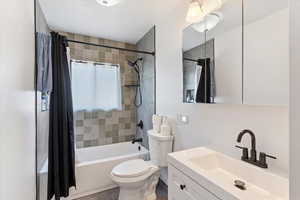 Main floor bathroom with shower / bath combo and vanity