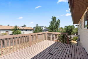 Wooden terrace featuring a residential view