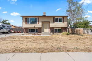 Raised ranch with brick siding