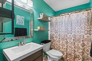 Bathroom with vanity and a shower with curtain