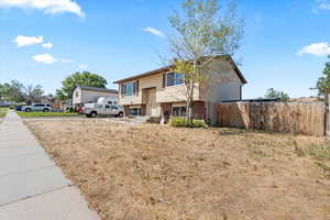 Raised ranch with brick siding