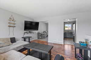 Living area featuring wood finished floors and baseboards