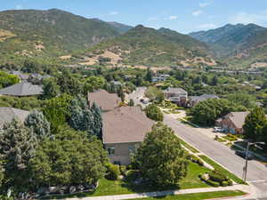 Aerial perspective of suburban area featuring a mountainous background
