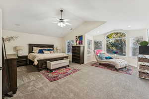 Bedroom featuring lofted ceiling, carpet floors, and ceiling fan