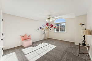 Unfurnished room with carpet floors and a ceiling fan