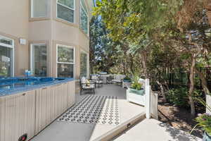 View of patio / terrace with outdoor lounge area and a hot tub