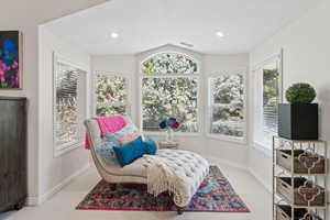 Sitting room featuring lofted ceiling and carpet floors