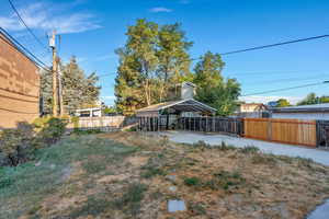 Fenced backyard with detached, two-car carport