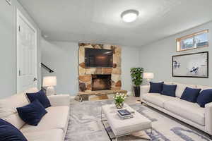 VIRTUALLY STAGED Carpeted living room featuring a fireplace