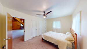 Bedroom featuring carpet flooring and ceiling fan