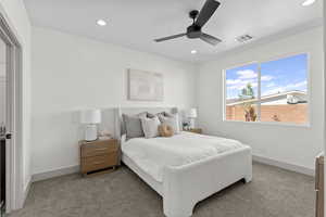 Bedroom with a ceiling fan, carpet flooring, and recessed lighting
