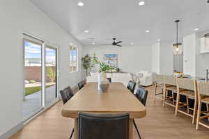 Dining room with light wood finished floors, recessed lighting, and a ceiling fan