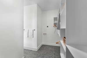 Full bath with baseboards and granite floors