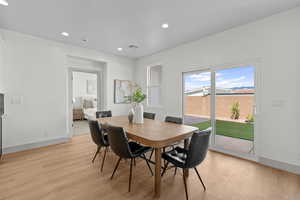 Dining area featuring recessed lighting and light wood-type flooring