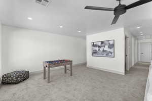 Rec room with light colored carpet, ceiling fan, and recessed lighting