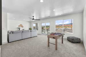 Playroom featuring a mountain view, ceiling fan, and recessed lighting
