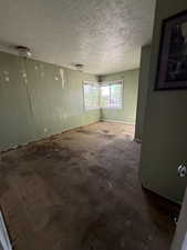 Bedroom featuring a textured ceiling