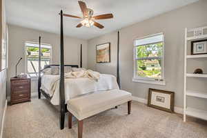 Bedroom with light carpet and ceiling fan