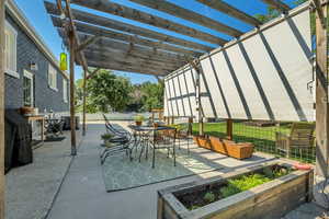 View of patio / terrace featuring a pergola, outdoor dining space, and area for grilling