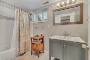 Vanity, shower / tub combo