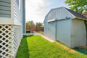 View of shed featuring a gate