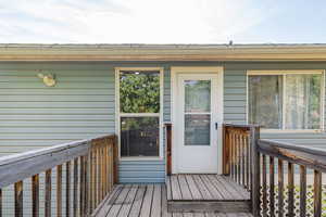 Property entrance featuring a deck