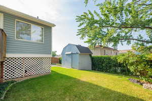 View of yard featuring a storage shed
