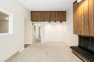 Unfurnished living room with carpet