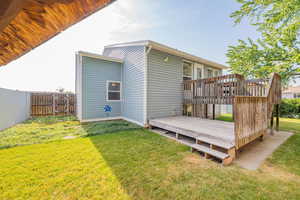 Back of house featuring a deck