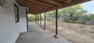 Fenced backyard featuring a patio