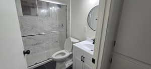 Full bathroom with vanity, a marble finish shower, and tile patterned flooring
