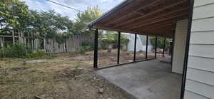 View of yard featuring a patio area and a storage shed