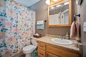 Bathroom featuring vanity and a shower with curtain