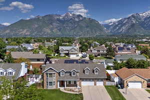 Aerial perspective of suburban area featuring a mountainous background