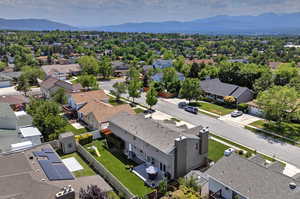 Aerial view of residential area featuring a mountainous background
